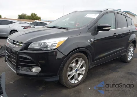 2015 Ford Escape Titanium z USA, uszkodzony, nr VIN 1FMCU0JX2FUC20718